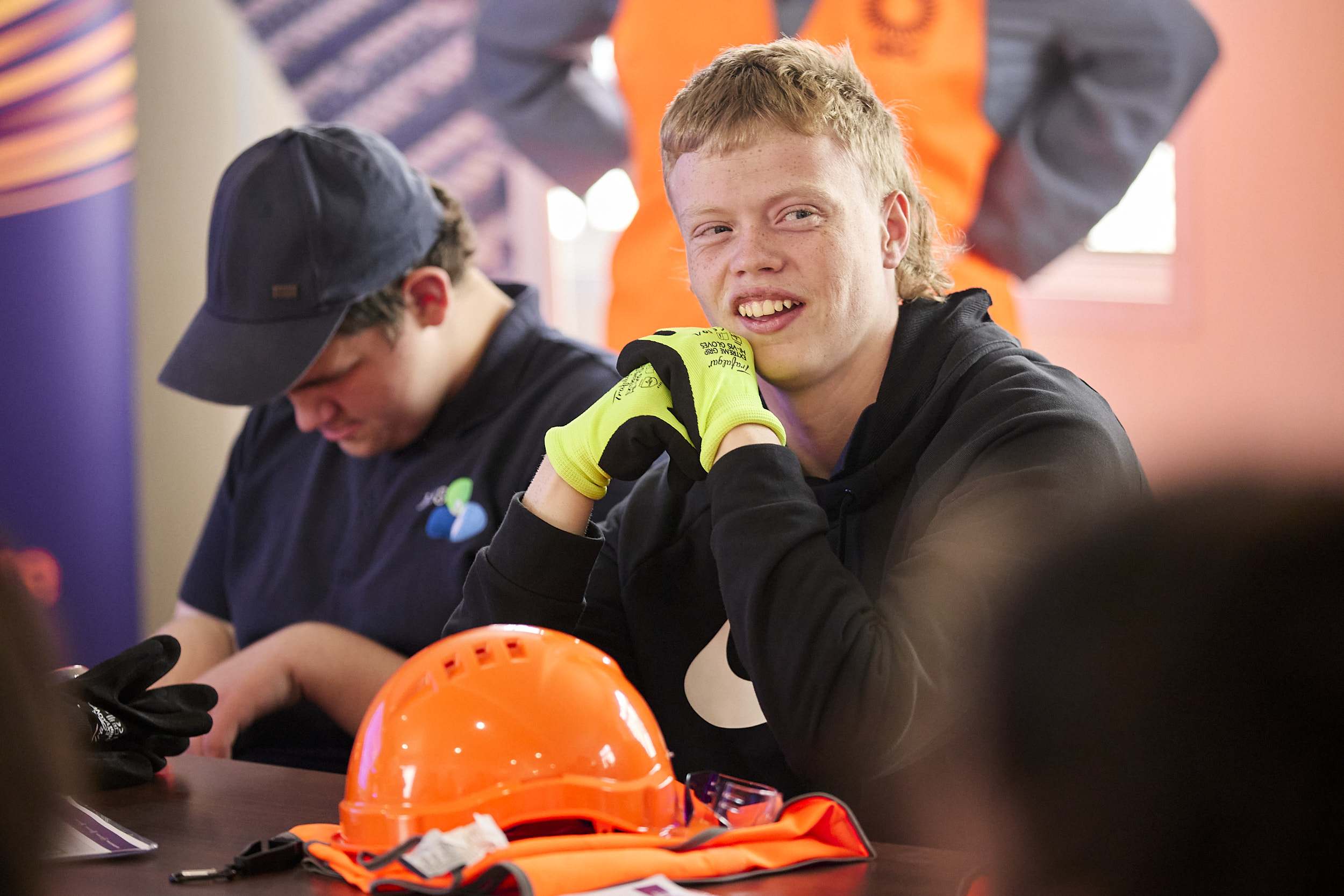 student sitting in front of PPE at MREH school visit